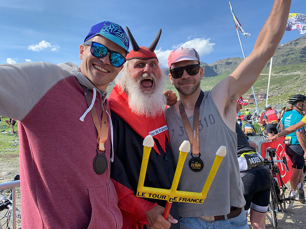 Kudo Coach co-founder Steve with his brother, and Didi the TdF Devil at the 2019 Etape du Tour finish line