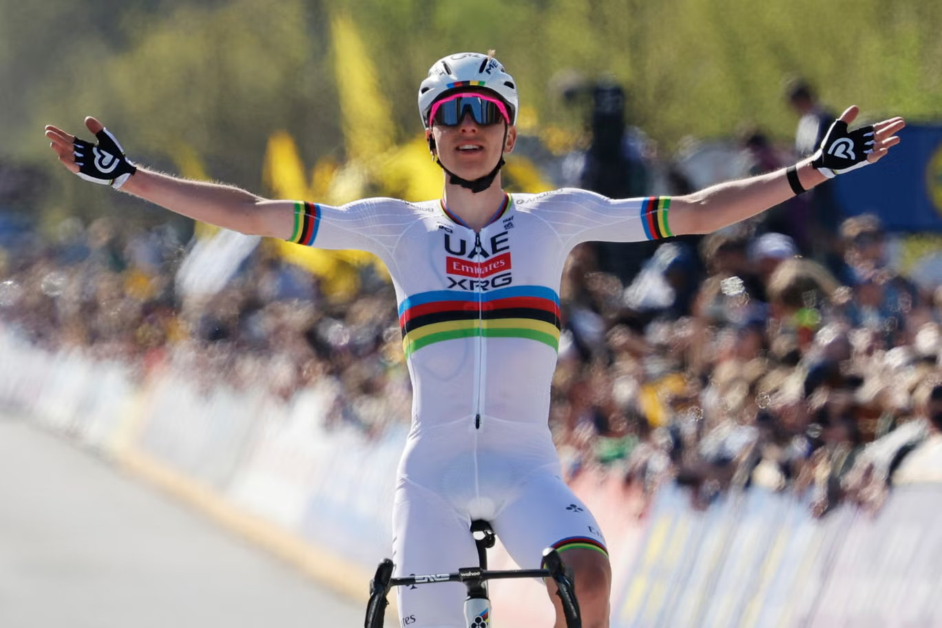 Tadej Pogačar riding in the world championship jersey